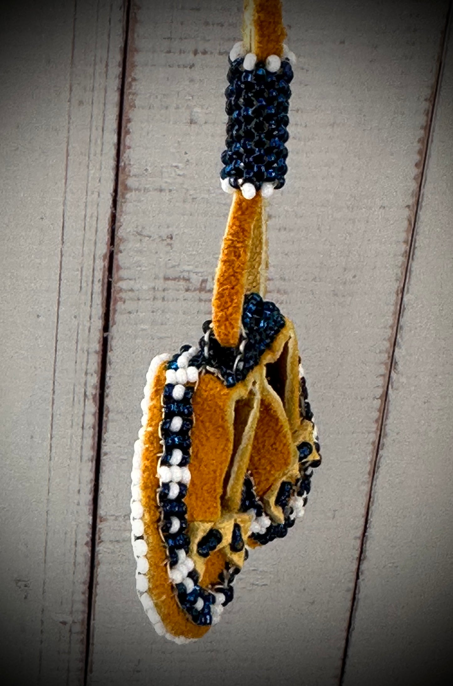 Tiny Treasures: Unique Beaded Moccasin Necklace