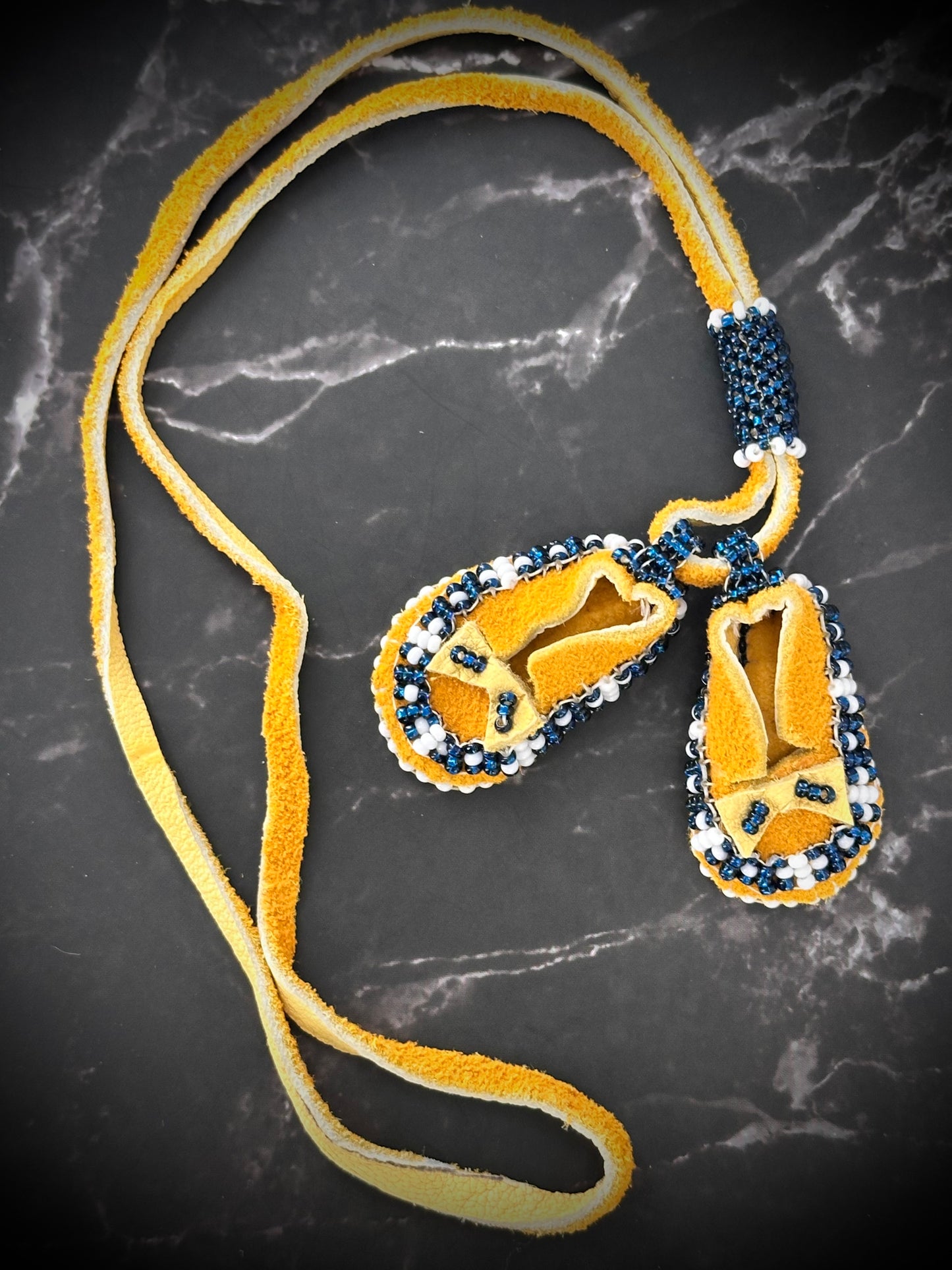 Tiny Treasures: Unique Beaded Moccasin Necklace